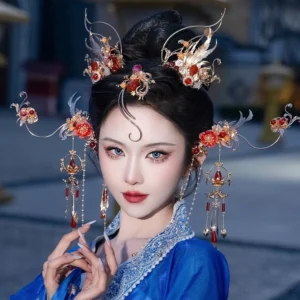 Woman wearing a red fox inspired Chinese Hanfu hair accessories set with gold filigree red floral gems and long beaded tassels