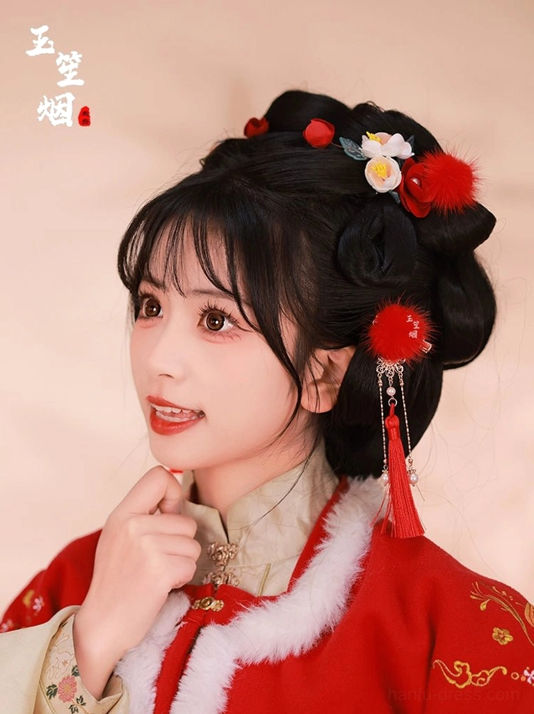 Side view of red furball Hanfu hair accessories with tassel pendants and floral ornaments styled with a traditional Chinese hairstyle