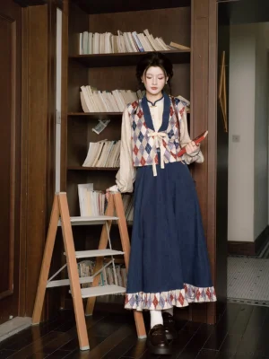 Modern Chinese style Hanfu outfit front view with argyle vest, lantern sleeve top, dark blue long skirt, white socks, leather loafers, and crossbody bag