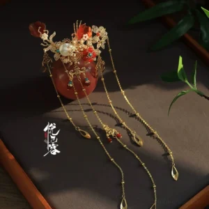 Red lantern tassel hair pin for Hanfu wedding hairstyle with gold floral filigree pearl beads and teardrop chain pendants close-up