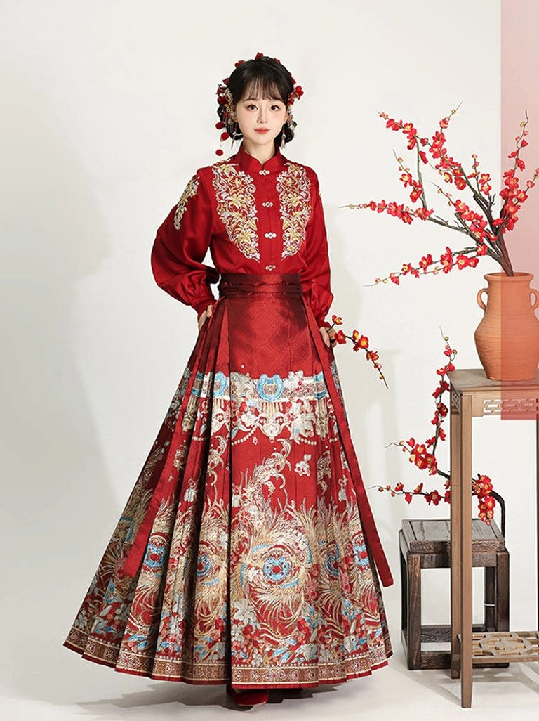 Traditional red Ming Dynasty Chinese Hanfu dress with golden embroidery and peacock floral mamian skirt front view