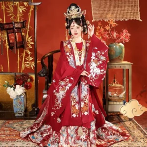 Red Ming Dynasty Chinese wedding Hanfu set with embroidered Xiapei sash and flowing Mamian skirt shown in a traditional bridal studio