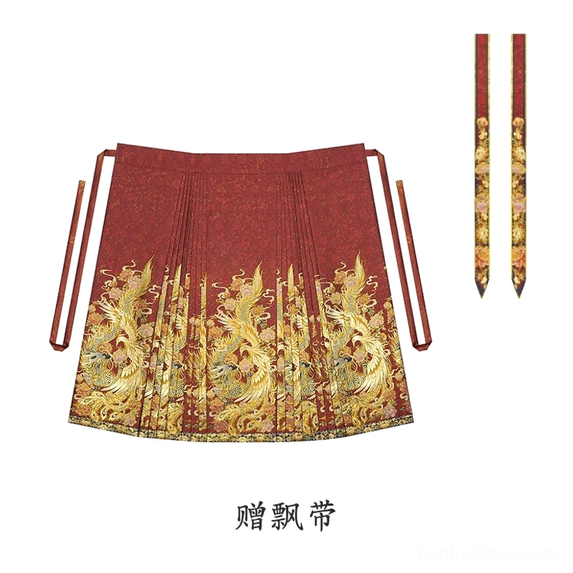 Flat lay display of a red Mamian skirt with golden phoenix and dragon woven brocade hem and matching decorative sashes