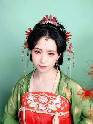 Model wearing red spider lily Hanfu hair pins with matching traditional Chinese hair ornaments, forehead jewelry, and tassel accessories in a Tang-style Hanfu look