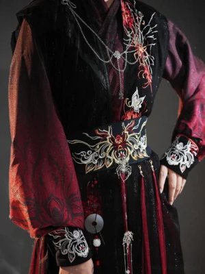 Close-up view of black and dark red Xianxia Hanfu costume details showing red spider lily and spider embroidery, waist belt, cuffs, layered neckline, and patterned fabric