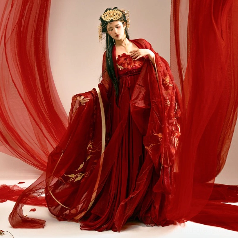 Three-quarter side view of a red Tang Dynasty Hanfu Heziqun dress with flowing layered fabric, golden embroidery on the robe and skirt, and an elegant lifted skirt pose