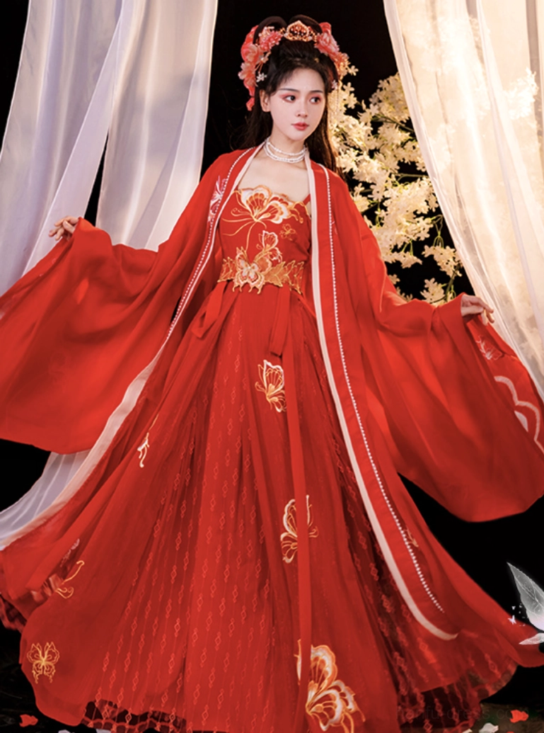 Side front view of a floor-length red Tang-style bridal gown with golden floral embroidery, pearl-decorated neckline, wide sleeves, and elegant Chinese wedding dress silhouette