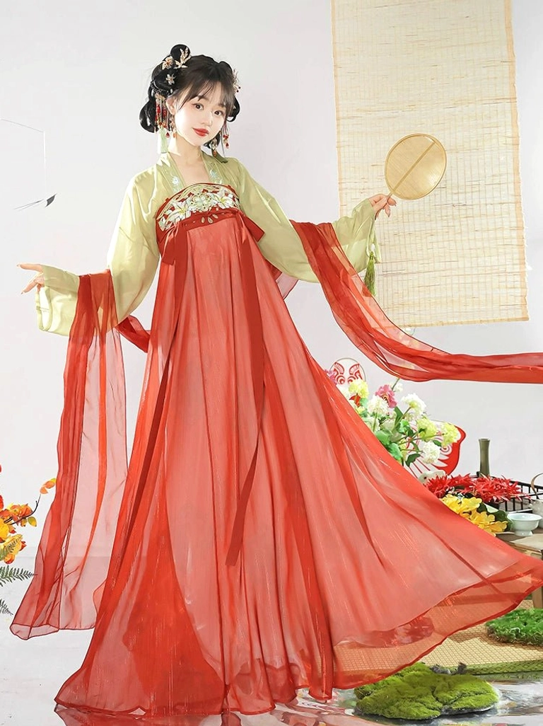 Red and light yellow Tang Dynasty Hanfu Qixiong Ruqun with sheer red chiffon skirt, embroidered chest panel, long sleeves, and round silk fan