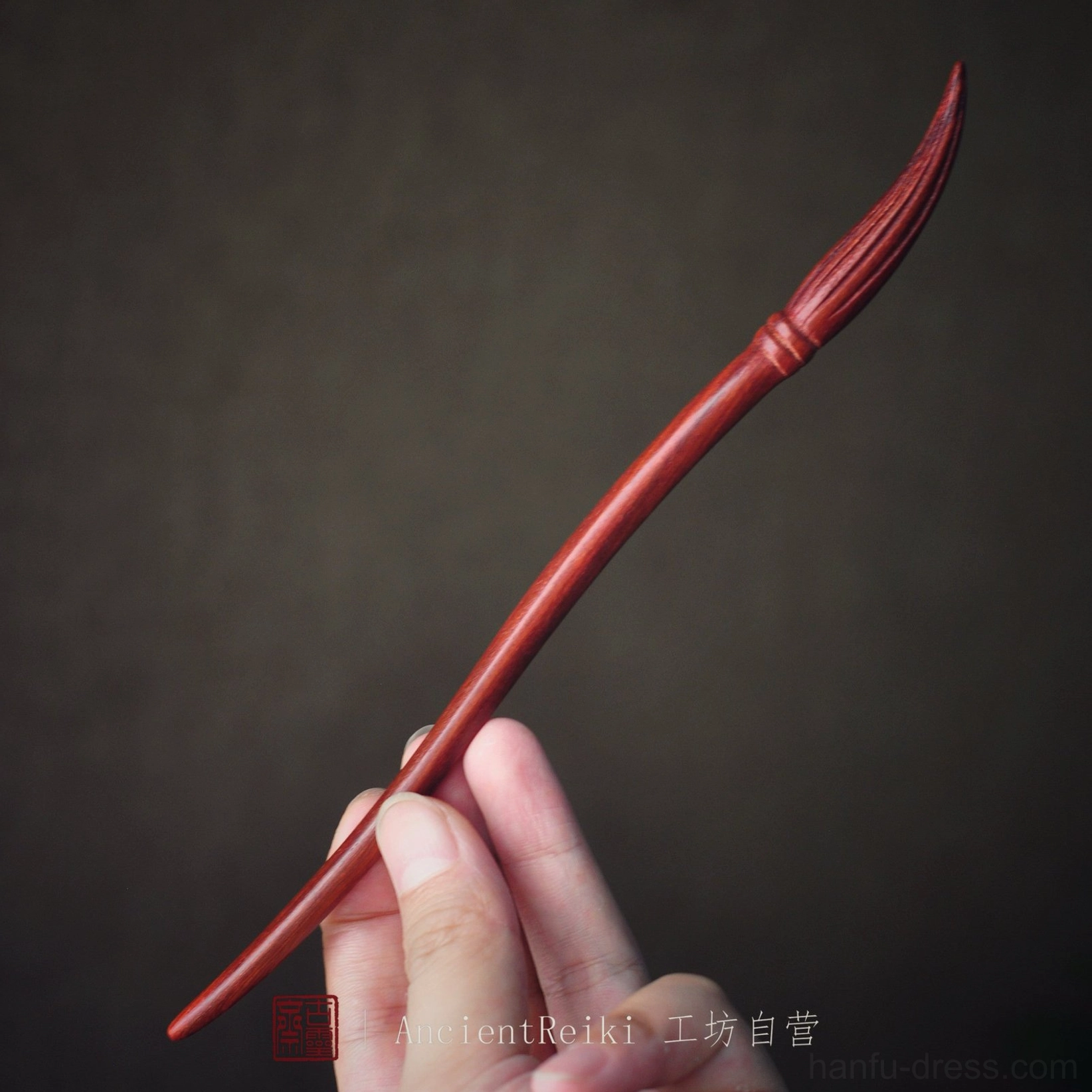Side view of reddish brown wooden ink brush hair stick with textured bristle carving for traditional Chinese Hanfu updo