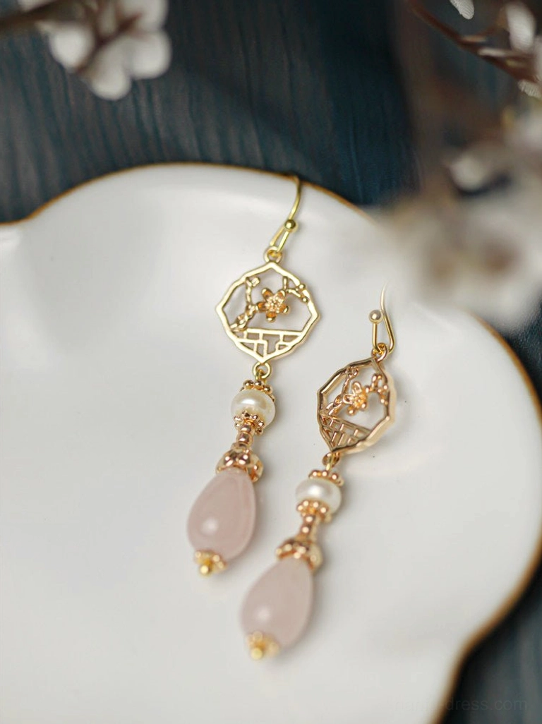 Flat lay of retro Chinese pearl earrings showing front and back of gold openwork floral window charms with pink drops