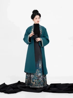 Full Returning Dragons Ming Dynasty Hanfu outfit with teal long jacket black knit top and dragon print mamian skirt front view