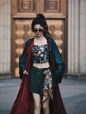 Front full-body view of a reversible Tang Dynasty Hanfu robe in emerald green and scarlet satin, styled as modern Chinese streetwear