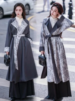 Reversible Tang Dynasty inspired Hanfu round collar robe shown on two female models in charcoal gray solid and vintage gray floral print styles with matching waist sashes