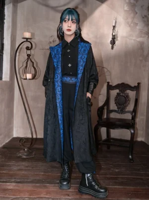 Full-body view of a reversible Tang-inspired modern hanfu long coat with black jacquard exterior, blue printed reverse side, matching waistband, black outfit, platform boots, and vintage Chinese-style interior