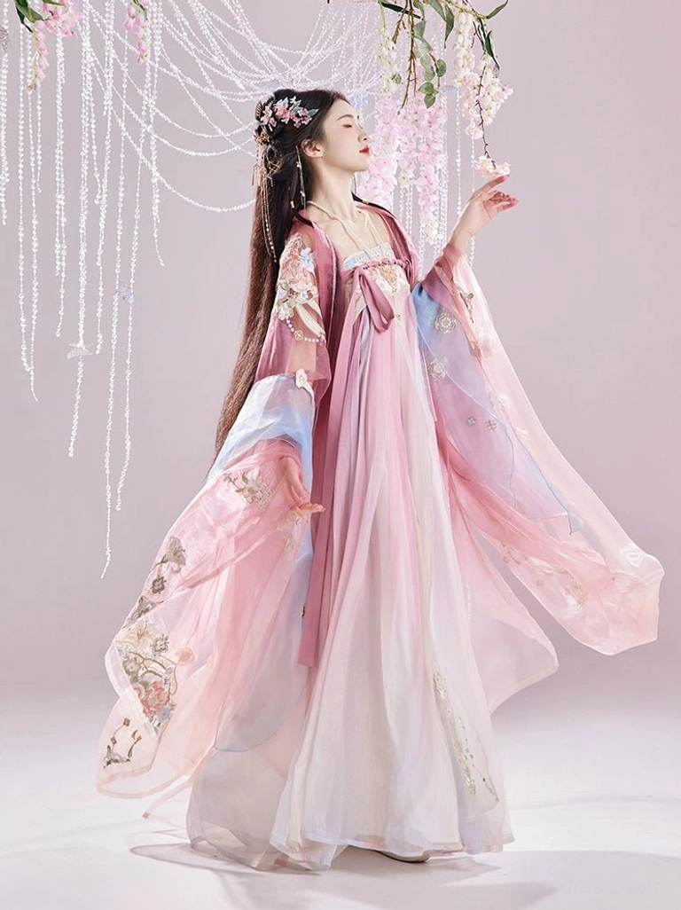 Side view of a romantic Tang Dynasty Hanfu dress with flowing wide sleeves, floral embroidered coat, pastel gradient skirt, and decorative front hanging ornaments
