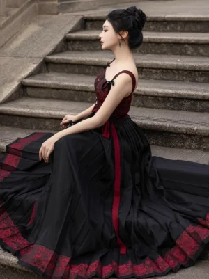 Side view of black and wine red Hanfu full set featuring a flowing pleated mamian inspired wrap skirt, bustier and long decorative waist ribbons