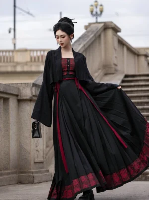 Black and dark red Ming Dynasty inspired Hanfu outfit with rose detail bustier, cropped cardigan and pleated mamian skirt shown in a full front view