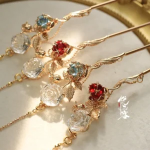 Rose Covenant crystal tassel Hanfu hairpins in red and blue displayed on a beige tray with gold rim