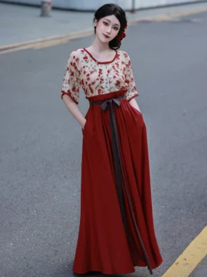 Full front view of a woman wearing a Rose Iced Tea Tang Dynasty Hanfu two-piece set with a floral Beizi top and flowing wine red elastic long skirt