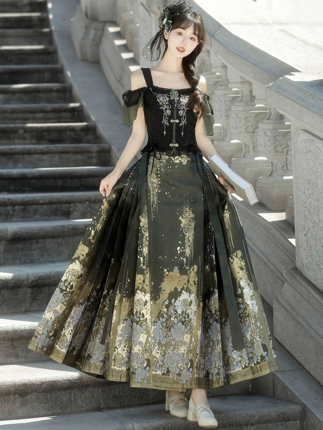 Side view of dark green Ming inspired modern Hanfu outfit with flowing pleated mamian skirt black waist ties and off shoulder top