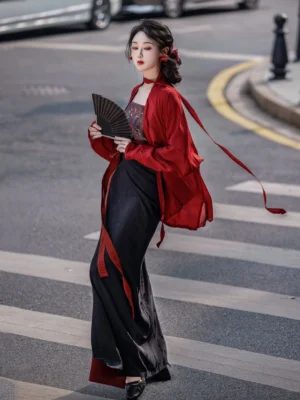 Rose Whispers Song Dynasty Hanfu set with wine red winged sleeve top and black red wrap skirt shown from a three-quarter side view on an urban street