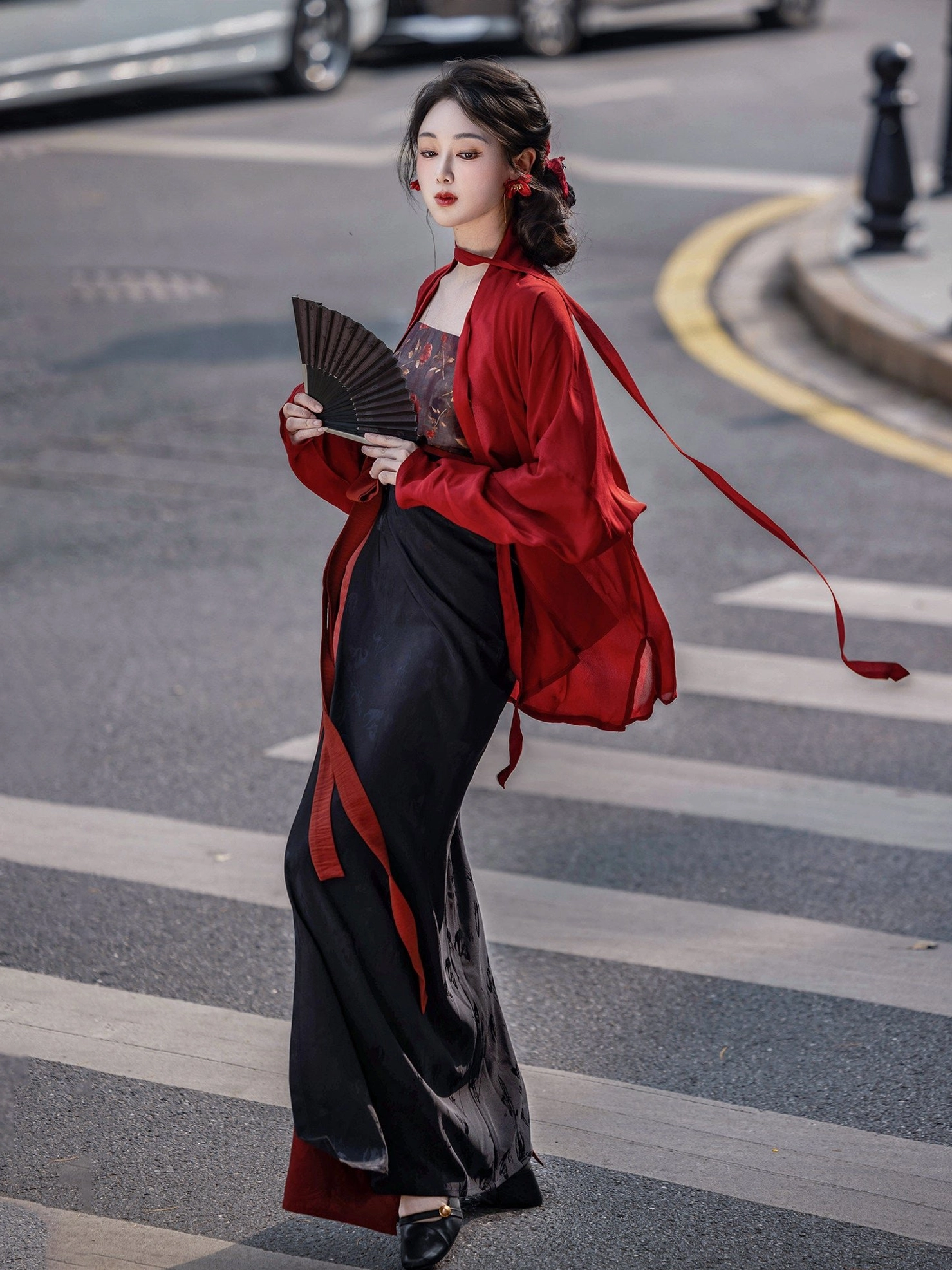Rose Whispers Song Dynasty Hanfu set with wine red winged sleeve top and black red wrap skirt shown from a three-quarter side view on an urban street