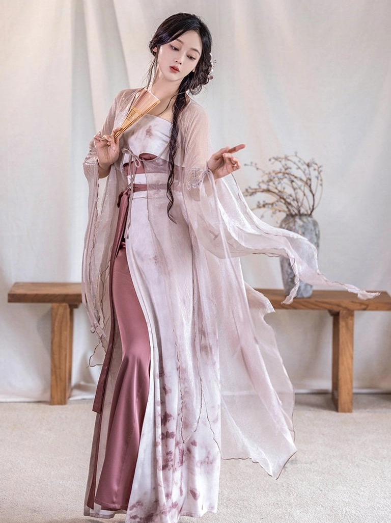 Three quarter view of Rouge Snow Song Dynasty Hanfu fairy outfit featuring flowing dusty rose cardigan wide sleeves and high waisted printed wrap skirt