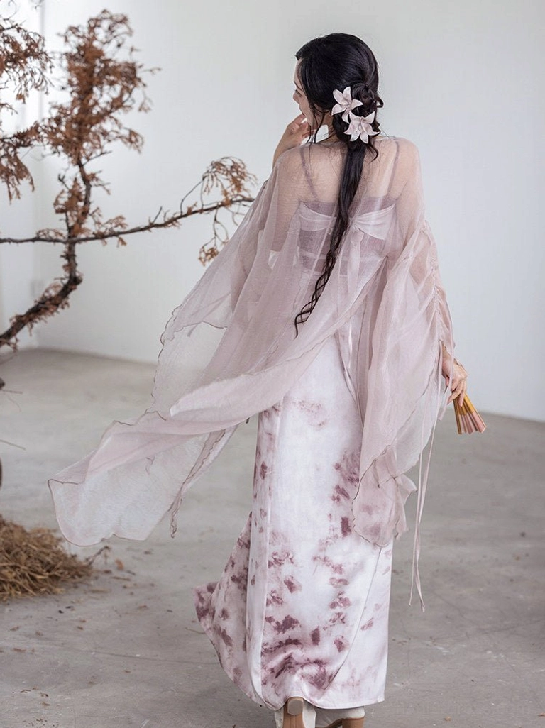 Back view of Rouge Snow Song Dynasty Hanfu outfit showing the long sheer fairy cardigan, ink wash floral skirt pattern, and braided hairstyle with flower hairpin
