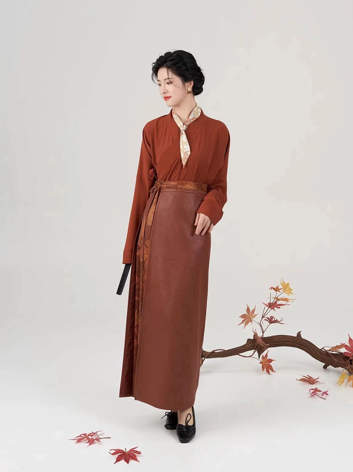 Rust-red Song Dynasty hanfu cross-collar inner top displayed with side waist ties and a flowing traditional Chinese silhouette