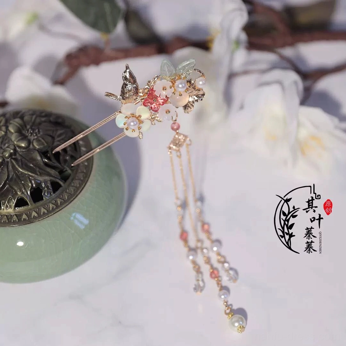 Close view of Ruyao Hanfu tassel hairpin featuring gold bird ornament pink flower beads pearl strands and crystal style dangling tassels