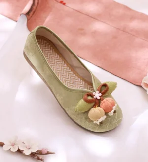 Sage green Chinese Hanfu flat shoe with fabric bow floral and fruit toe ornaments textured canvas upper and chevron patterned insole