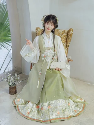 Sage green Ming Dynasty Hanfu full set with embroidered vest white robe and floral mamian skirt styled on a seated model
