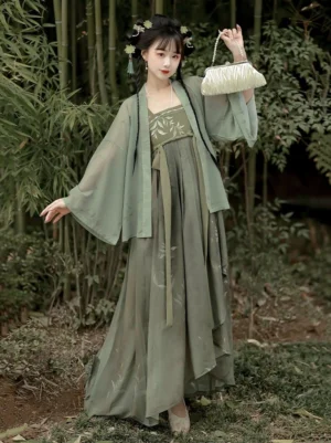 Sage green Tang Dynasty Qixiong Ruqun modern Hanfu dress set front three quarter view in a bamboo garden