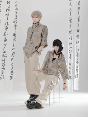 Relaxed modern Chinese streetwear outfit featuring a stand collar zipper shirt and printed cargo pants with ripped details, modeled in standing and seated poses