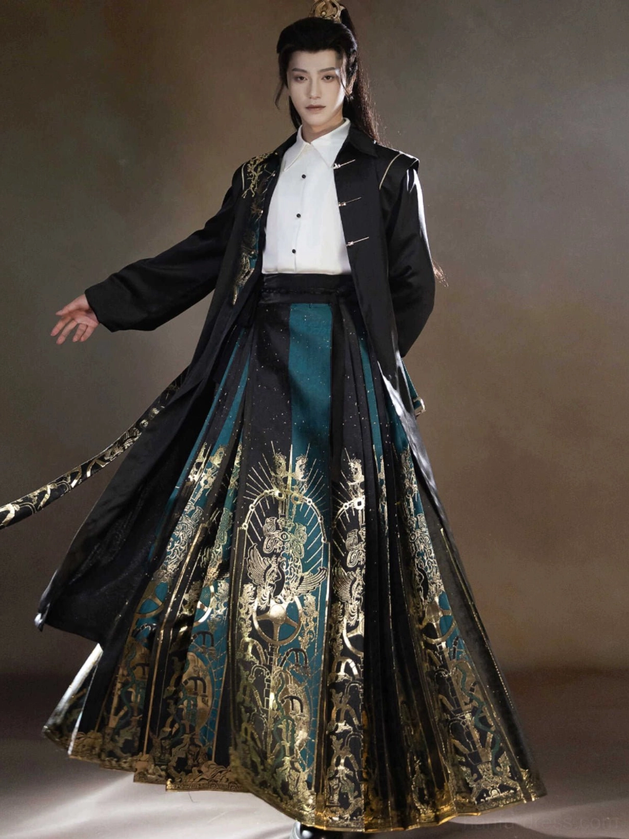 Back three quarter view of a flowing black Sanxingdui Hanfu robe layered over a white shirt and patterned green gold mamianqun horse face skirt