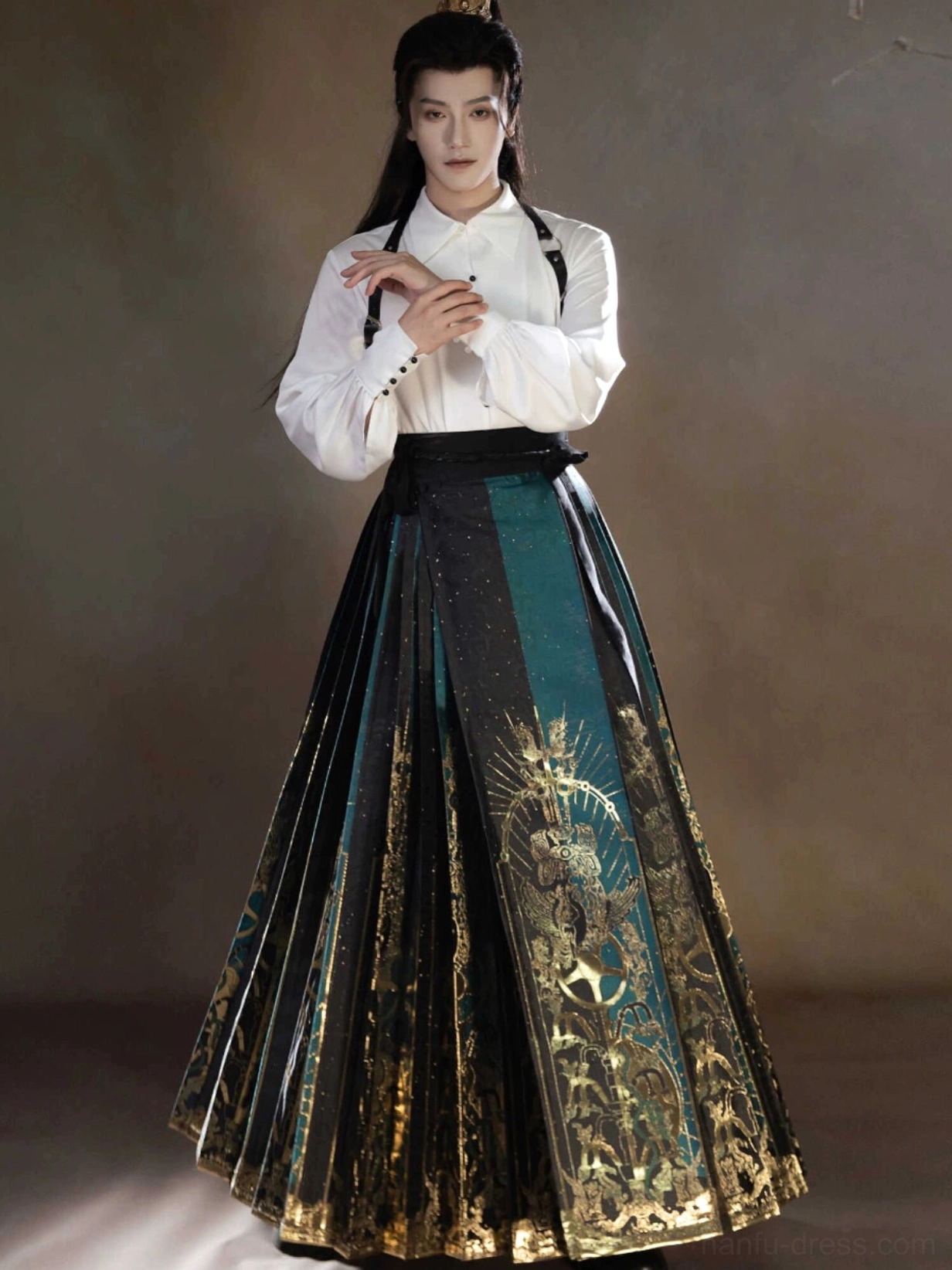 Front view of separate Sanxingdui Hanfu pieces including a white puff sleeve shirt and full length dark green gold mamianqun horse face skirt
