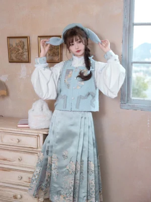Side view of Sea Salt Cream Ming-inspired Hanfu outfit with embroidered bijia vest and light blue mamianqun skirt