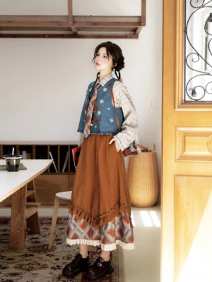 Sea Salt Mocha modern hanfu vintage academia layered outfit side view with striped long sleeve top embroidered vest and ruffled brown skirt