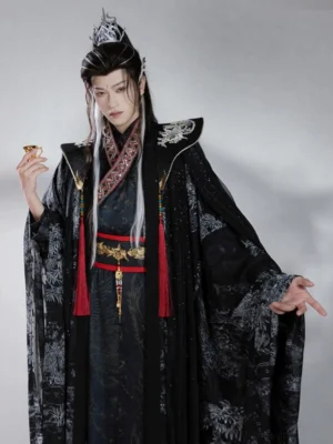 Men's black Xianxia Hanfu costume front view featuring translucent printed cloak, cross-collar robe, silver cloud shoulders, and red tassel waist sash