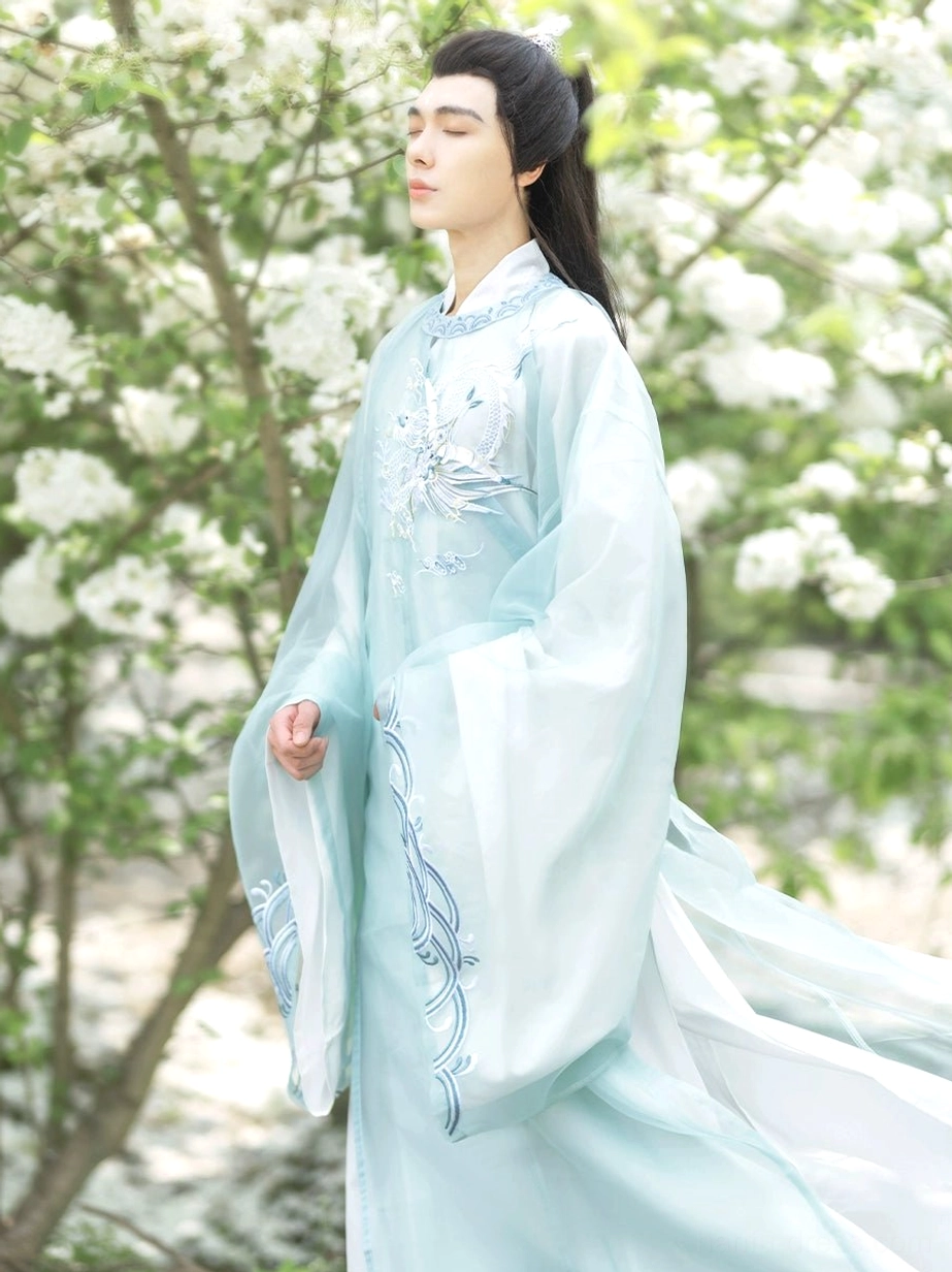 Azure Tang Dynasty round collar Hanfu robe for men featuring flowing long hem bird embroidery and wave sleeve motifs
