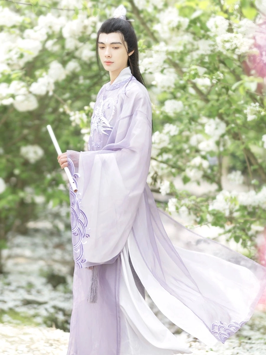 Purple Shan Hai Jing Tang Dynasty round collar Hanfu robe for men shown in a flower garden with embroidered chest and sleeve details