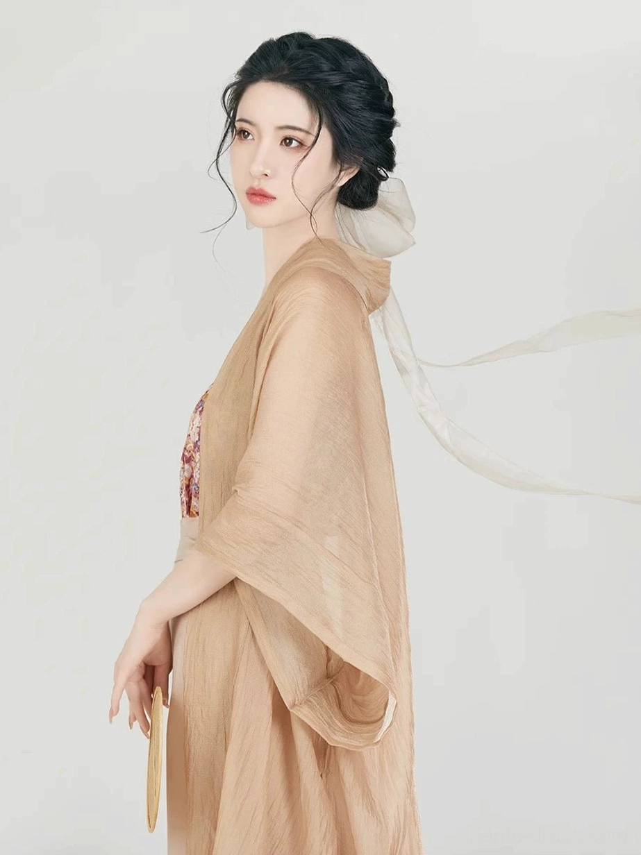 Half-body back side view of the sheer light tan Changgan Temple-inspired Hanfu beizi jacket with wide dropped sleeves and flowing relaxed silhouette