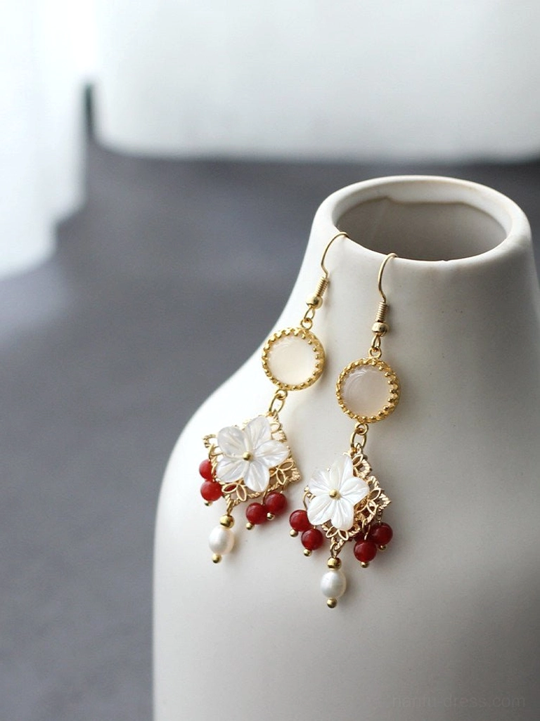 Vintage Chinese style shell flower earrings showing gold tone filigree base red bead details and pearl drops