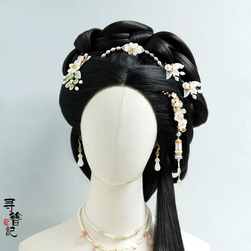 Shell leaf Hanfu hair pin styled on a traditional Chinese updo with matching pearl tassel ornaments, earrings, and layered necklaces