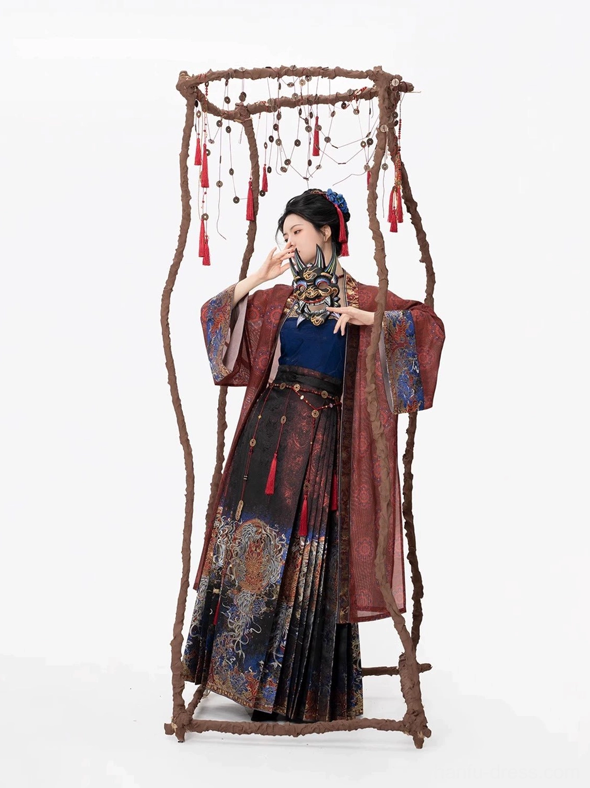Three-quarter front portrait of the Shen Nuo Hanfu outfit highlighting the red waist tassel and woven mythical-creature motifs on the mamian skirt