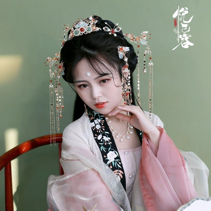 Front portrait of traditional Hanfu hairstyle styled with Shengzhao long tassel hairpins and crown accessories
