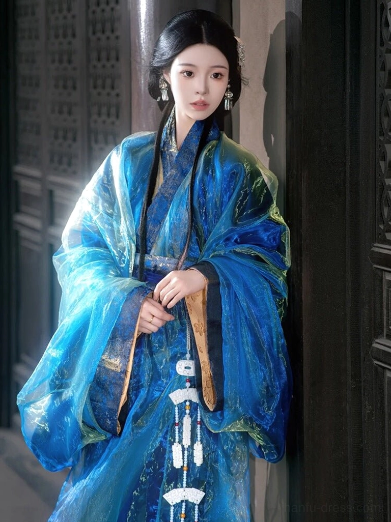 Close-up front view of a traditional Han straight-hem Hanfu robe in shimmering sky blue sheer fabric with a classic cross-collar design and white jade-style tassel ornaments