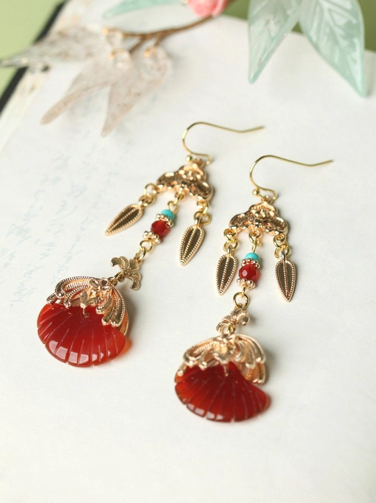 Traditional Chinese red fan drop earrings with hook fasteners, gold filigree-style metalwork, and turquoise blue bead details on vintage paper