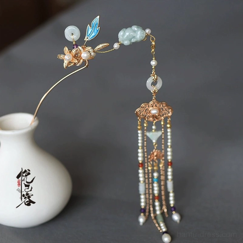 Close side view of the Si Yao Zhu Chinese hair pin with blue enamel leaf, jade-like bead, pearl pendant, gold-tone setting, and long beaded tassel