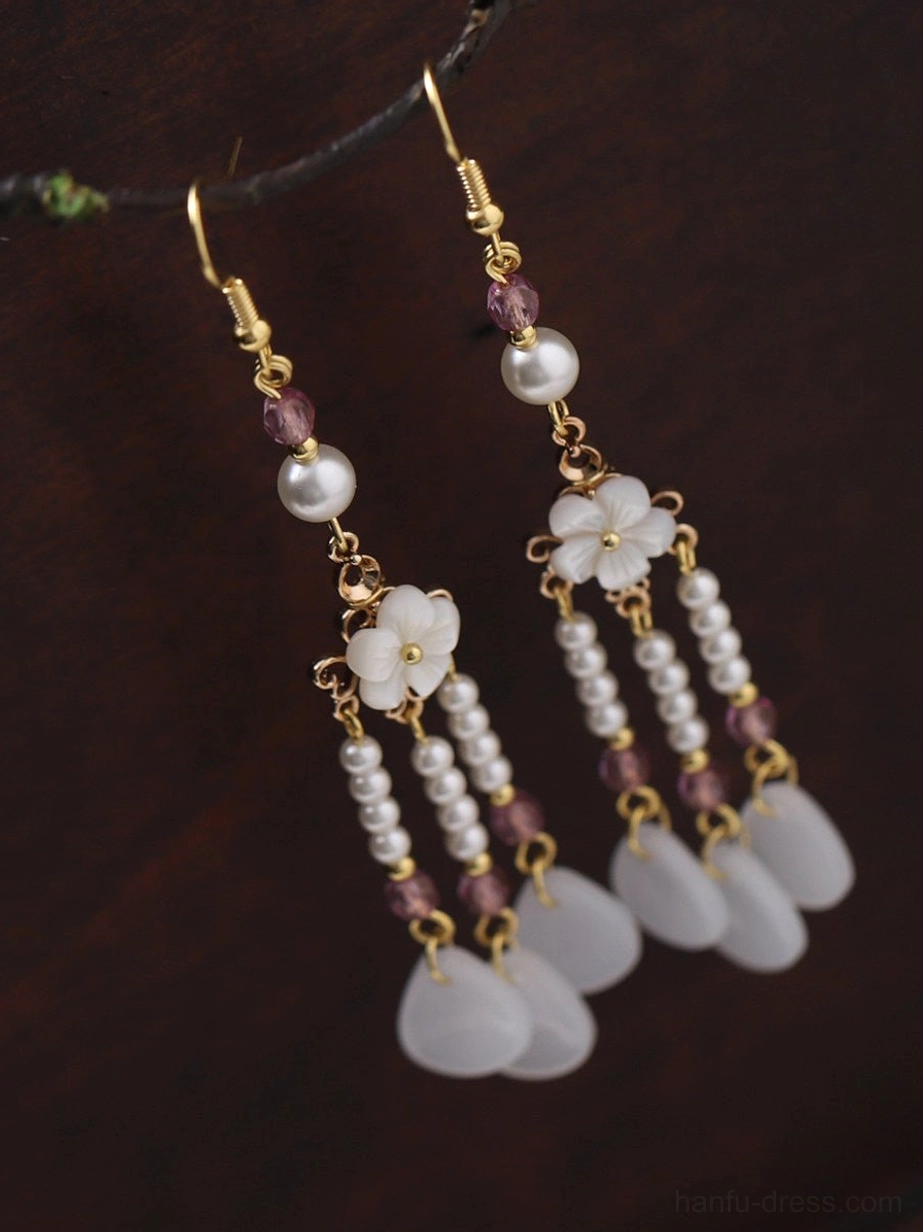 Side view of Chinese vintage tassel drop earrings with hidden gold connection chains layered pendants and floral decorative charms